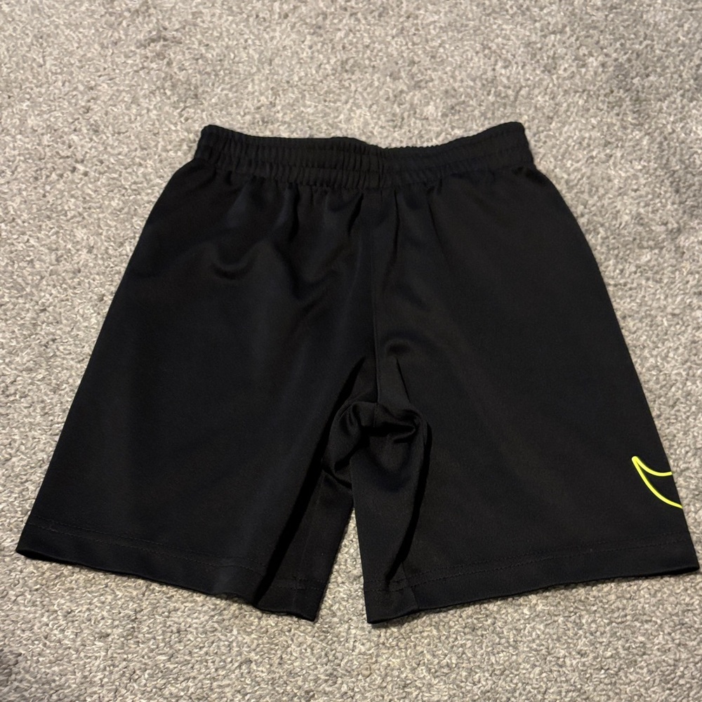 Nike Black Athletic Shorts with Yellow Accent